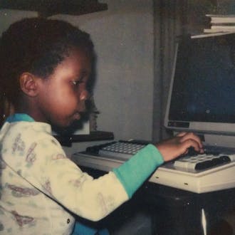 James McClain as a young child, typing at a computer
