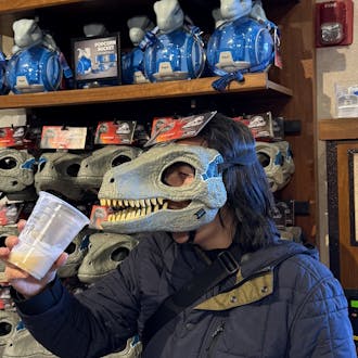 Xuan Huang in dinosaur mask