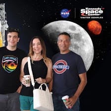 Chris Andrews (right), his wife (center), and son (left)