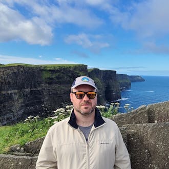 Mike Frederick, senior software engineer, focused on infrastructure. In this photo, he is at the Cliffs of Moher, Ireland.